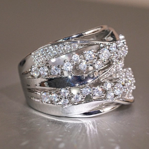 Close-up of elegant silver criss-cross ring with shimmering cubic zirconia pave setting