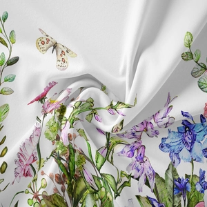Macro detail of bohemian tapestry showing soft watercolor floral prints and fabric texture