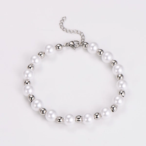Detailed close-up of retro pearl and silver bead bracelet with adjustable lobster clasp closure