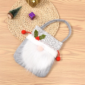 Detail of Christmas gnome gift bag with gray felt and soft white faux fur beard