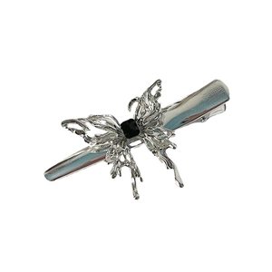 Silver liquid metal butterfly hair clip with black gemstone accent on white background