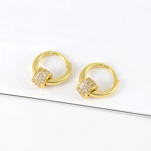 Elegant gold-plated spinning earrings with round hoops and pave-set zircon pendant drops