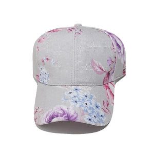 Close-up of floral print pattern on gray linen baseball cap with purple and pink flowers