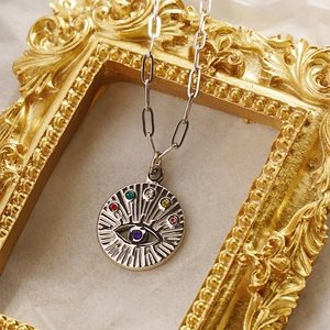 Colorful Evil Eye pendant necklace in stainless steel with clip chain on vintage frame