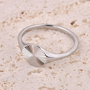 Polished silver signet ring with engraved sunburst pattern on high-quality stone base