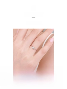 Close-up of minimalist S925 sterling silver ring with a sparkling round zircon stone