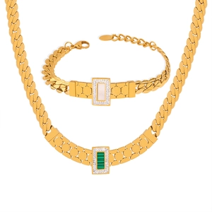 Gold geometric jewelry set with necklace and bracelet featuring white shell and malachite