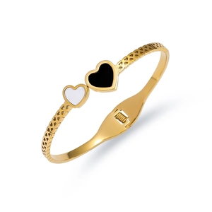 Gold titanium steel heart bangle featuring black and white enamel heart motifs for women