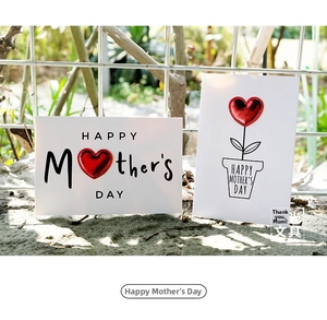 Detail of DIY Mother's Day cards with 3D red leather hearts on white premium cardstock