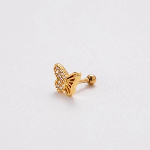 Detailed close-up of golden butterfly cartilage stud earring with cubic zirconia accents
