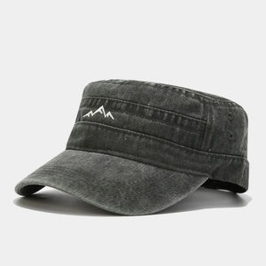 Close-up of a grey washed cadet cap featuring detailed white mountain peak embroidery