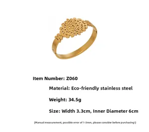 Detailed view of leaf pattern gold bangle with 3.3cm width and 6cm inner diameter specs