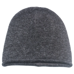 Detailed texture of charcoal grey knit wool hat with stylish rolled edge and ribbed weave