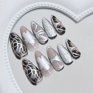 Silver metallic press on nails with Y2K 3D butterfly design on heart mirror