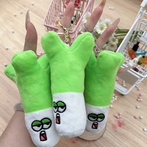 Cute plush scallion keychain charms with funny expressions held in hand