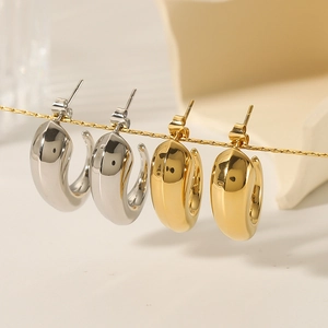 Chunky stainless steel C-shaped hoop earrings in polished gold and silver finishes