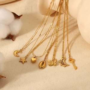 18K gold plated stainless steel necklaces with moon, star and heart pendants set on fabric