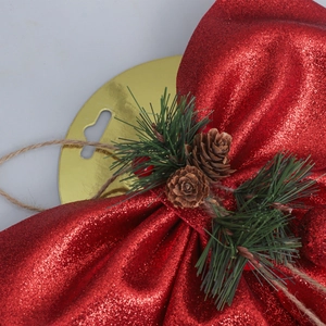 Sparkly red Christmas bow with pine cones and berries decoration for holiday trees