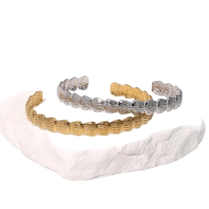 Minimalist 18k gold and silver stainless steel open bangles with shell texture on stone