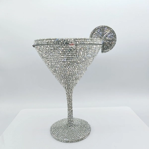 Detailed view of silver martini glass evening bag with crystal rhinestones and lemon slice charm