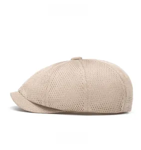 Detail view of the breathable hollow mesh structure on a beige summer flat cap side profile