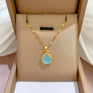 Titanium steel gold necklace featuring blue teardrop pendant and crystal bee accent