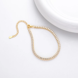 Close-up of gold-plated S925 sterling silver tennis bracelet with cubic zirconia stones