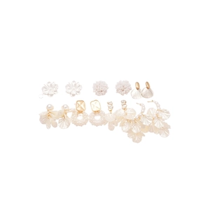 7-pair set of floral and pearl earrings in gold and white tones on a clean white background