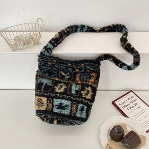 Detailed view of plush geometric patchwork bucket bag in a lifestyle setting