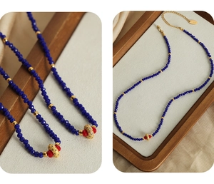 Detailed macro view of faceted dark blue beads with golden spacers and S.Steel tag
