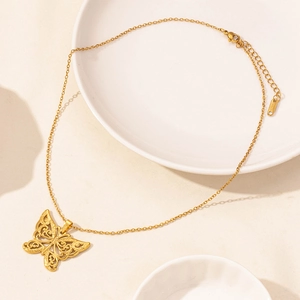 Detailed view of gold stainless steel butterfly necklace with S.STEEL material hallmark