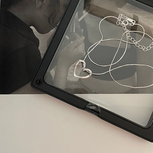 Minimalist 925 sterling silver heart necklace displayed in a modern frame box