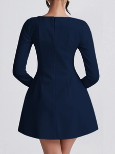 Rear view of long-sleeve navy blue cocktail dress featuring back hidden zipper closure