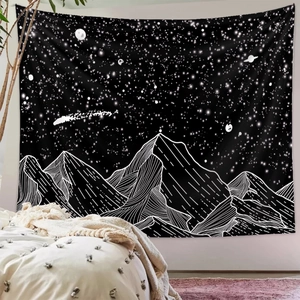 Detail of minimalist black and white mountain tapestry in a modern bedroom interior