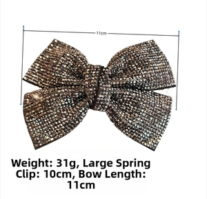 Detail view of large 11cm bow hair clip with dark grey rhinestones and 10cm spring clip