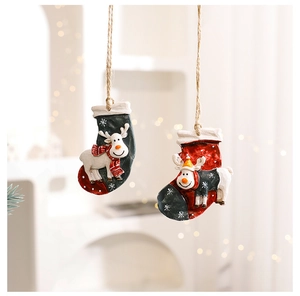 Detailed close-up of resin reindeer Christmas stockings ornaments with warm festive lighting