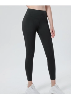 Close-up of high-waist black yoga leggings with tummy control and peach lift effect