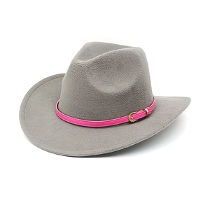 Detail of light gray felt cowboy hat featuring a vibrant pink belt and metallic buckle