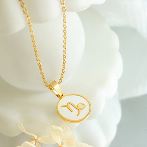 Elegant 12 zodiac Capricorn white shell necklace with a minimalist gold chain for women