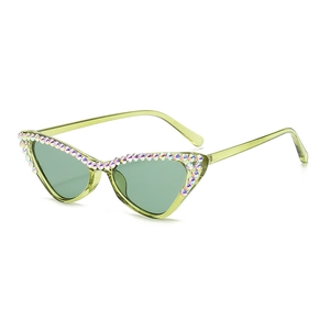 Chic light green cat-eye sunglasses with rhinestone trim and translucent lenses