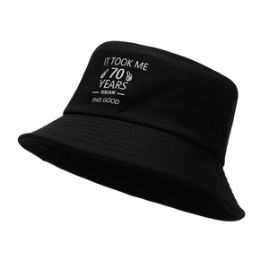 Black bucket hat with 70th birthday print showing 45-degree angle on white background