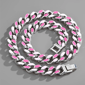 Close-up of silver Cuban chain with alternating pink and white enamel links and secure clasp