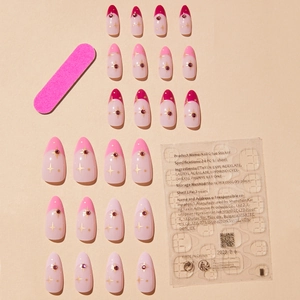 Almond French press-on nails with pink gradient star patterns and purple gemstones