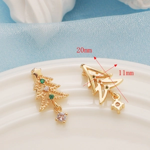 Detailed view of 14K gold plated Christmas tree earrings with green and white zircons