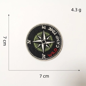 7cm round embroidered Wild Camp patch with compass design for outdoor backpacks and jackets