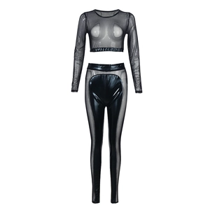Detail of black two-piece set featuring sheer mesh crop top and faux leather拼接pants