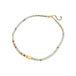 Handmade beaded necklace with blue and brown stones and a freshwater pearl accent