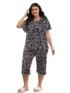 Detail view of plus size floral loungewear set featuring short sleeves and cropped pants
