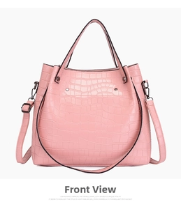 Front view of pink crocodile embossed tote bag with dual handles and metal hardware detail