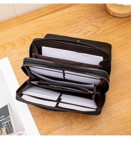 Struttura interna di un portafoglio lungo con doppia zip, asole per carte e scomparti banconote